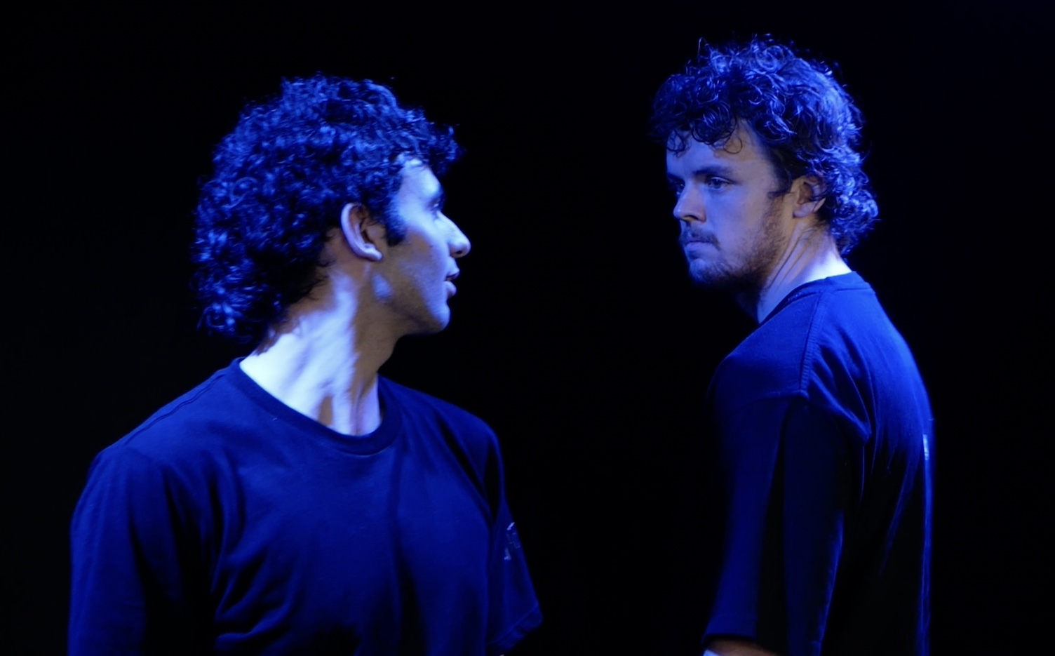 Two male actors demonstrating intense focus and presence during an acting scene, embodying Patsy Rodenburg’s teachings.